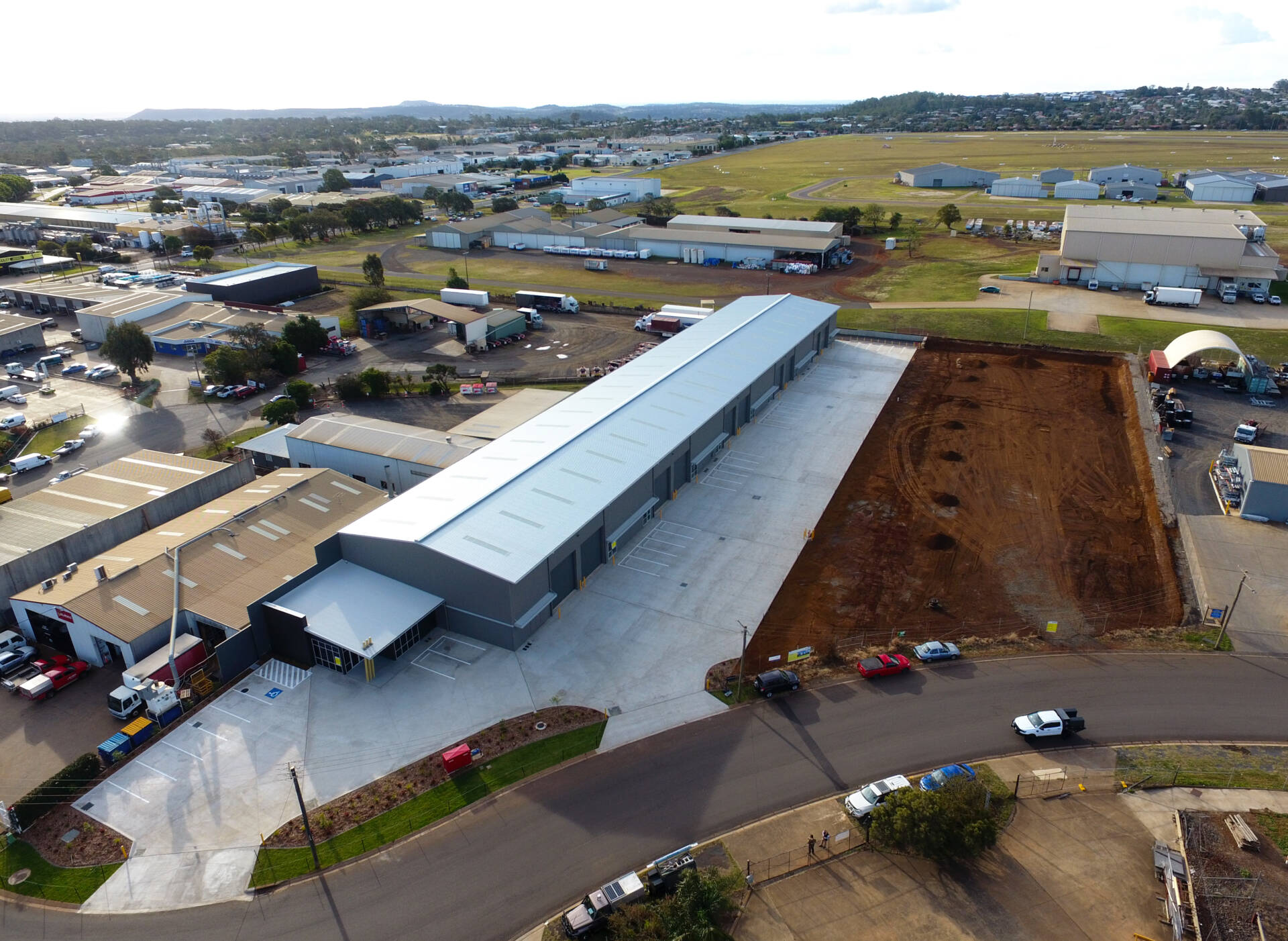 Large clearspan steel warehouse building with multiple open bays for industrial storage