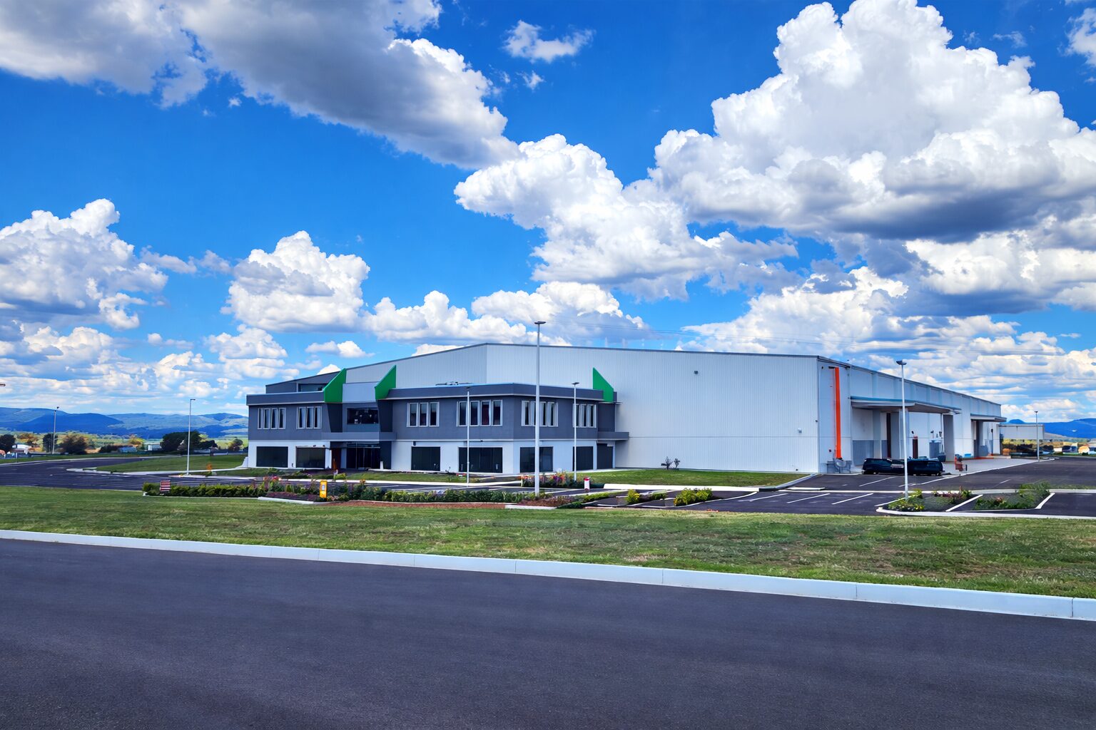 Large clearspan steel industrial shed used for equipment storage and operations
