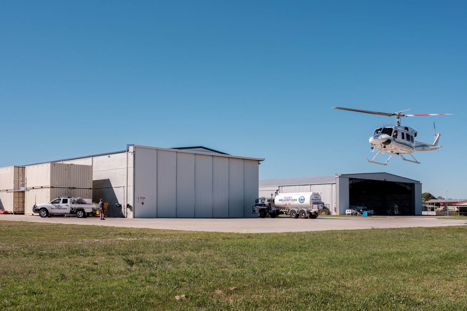 Helicopter landing outside a purpose-built aviation hangar and operations facility constructed for Fleet Helicopters.