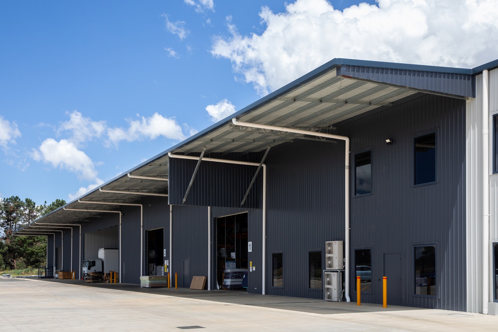 Steel warehouse facility featuring a covered loading canopy designed to support efficient loading, weather protection and day-to-day operations.