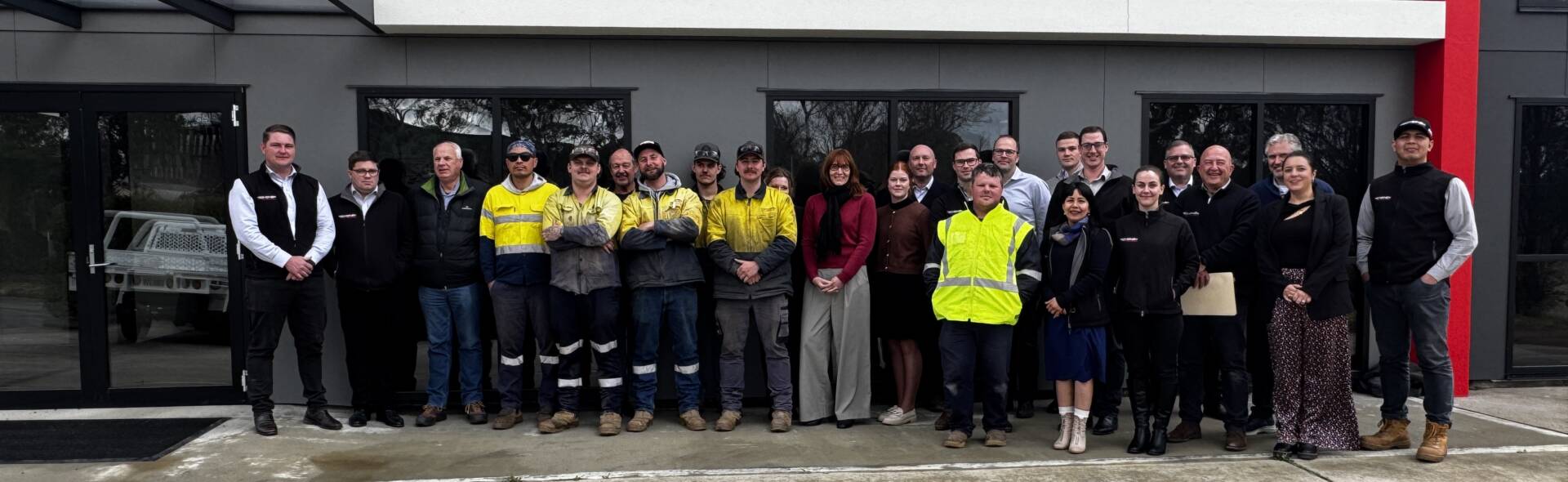 TechSpan team standing together in front of the building for a group photo