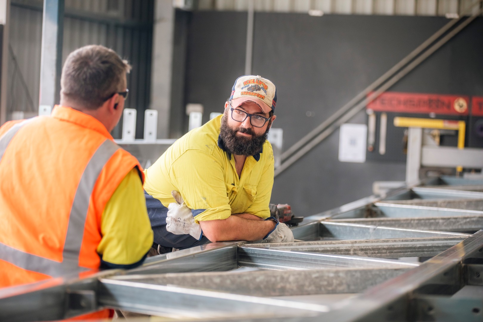 Two TechSpan team members working together in the workshop