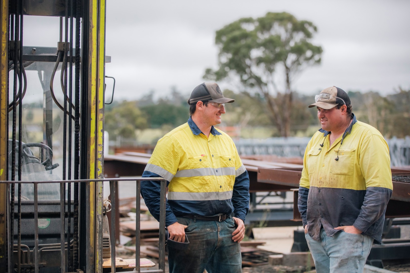 Two TechSpan team members discussing a project in the structural steel yard
