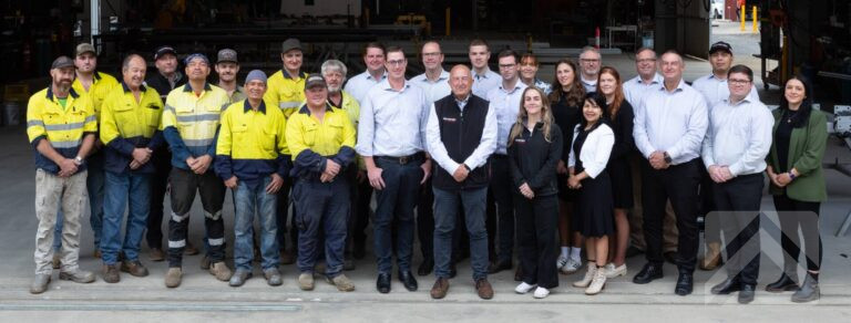 TechSpan team standing together inside the manufacturing and fabrication shed