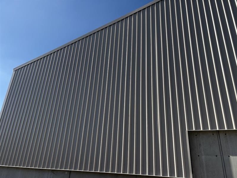Side wall enclosure installed on an industrial effluent shed featuring Colourbond® Trimdek cladding, structural steel framing and existing concrete infrastructure.