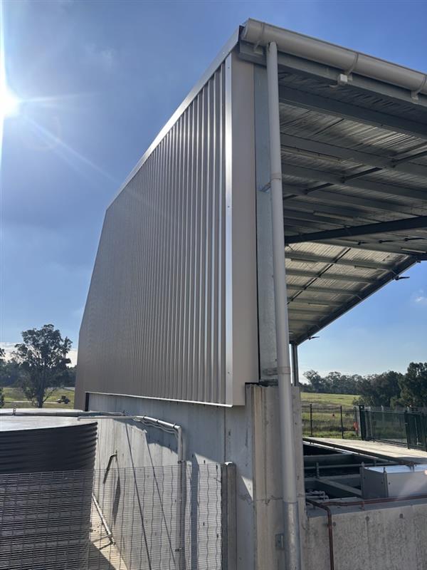 Side wall enclosure installed on an industrial effluent shed featuring Colourbond® Trimdek cladding, structural steel framing and existing concrete infrastructure.
